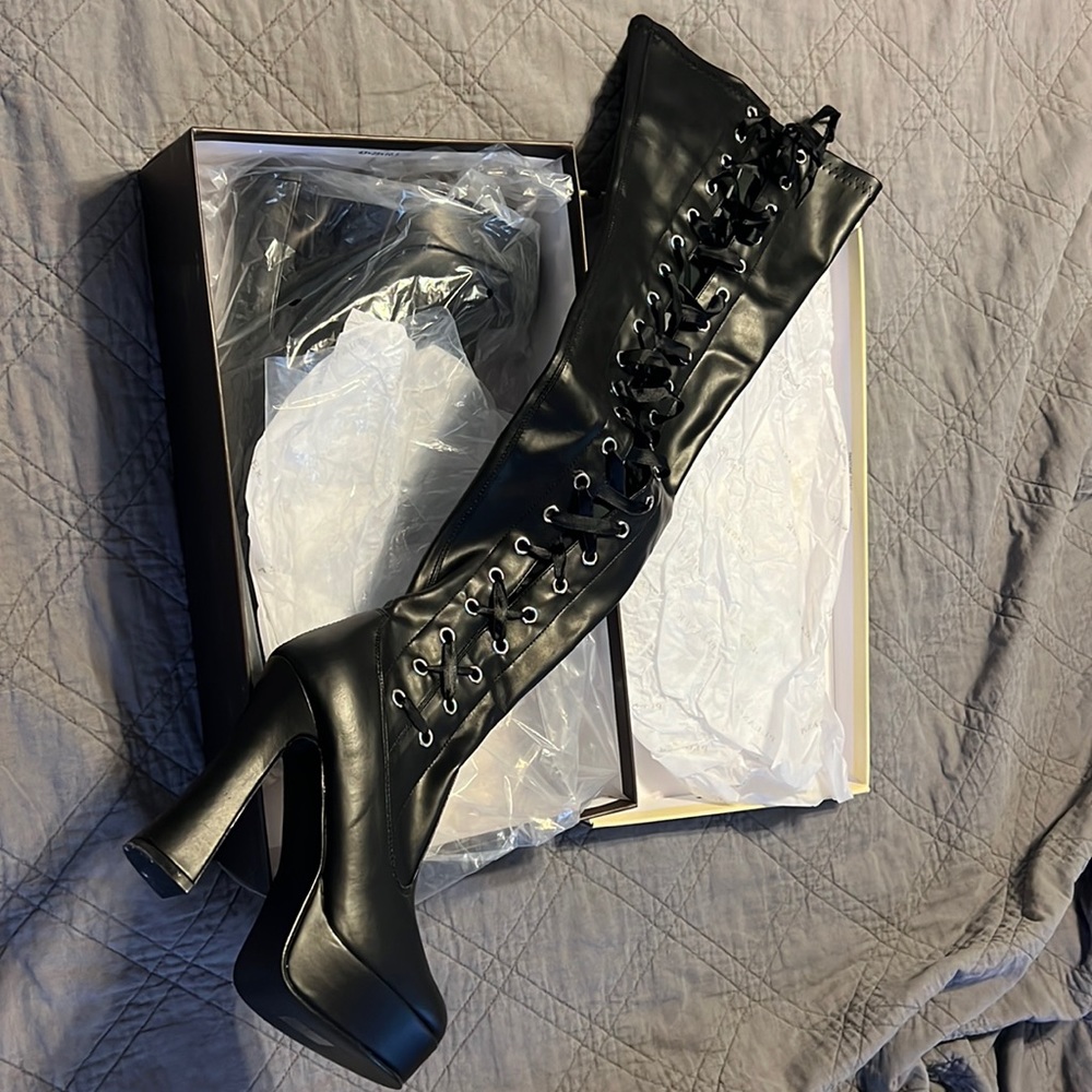 Black lace up thigh high boots